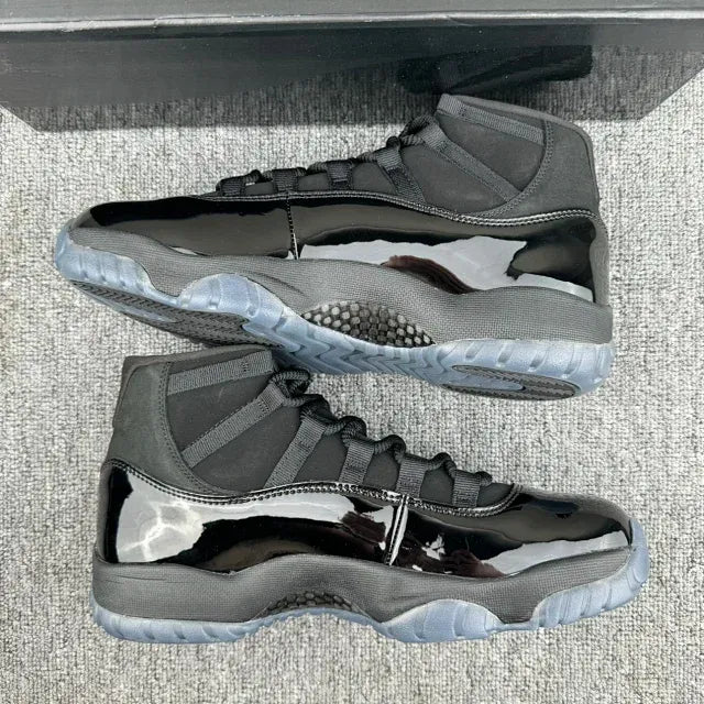 Jordan 11 high-top sneakers, dark gray and black pair with light gray outsole and mesh panels