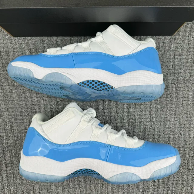 White and blue low-top sneakers with mesh-style panel and patterned outsole