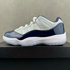 Low-top Jordan 11 sneakers, cream and navy, white laces and outsole