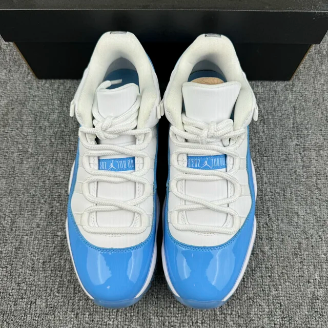 Back view of white and blue low-top sneakers with heel tabs and laces