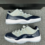 Low-top Jordan 11 sneakers, cream mesh and navy glossy overlays, white sole