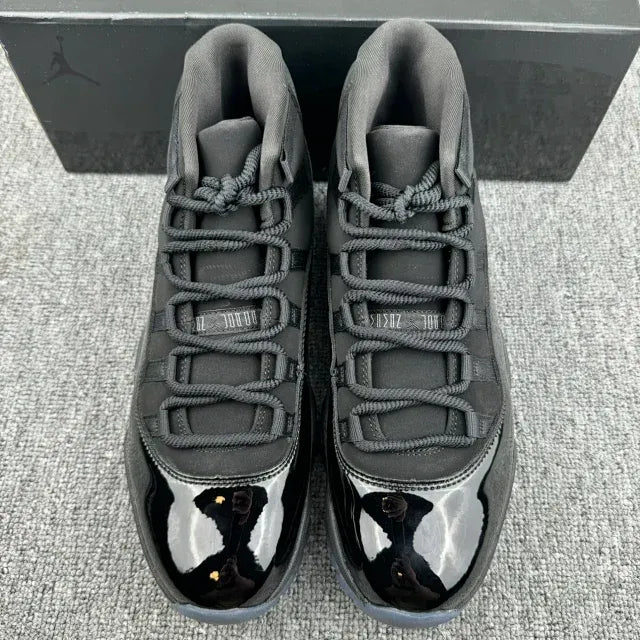 Jordan 11 high-top sneakers front view, gray laces with black-and-white toe panels