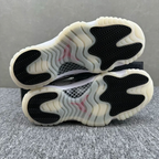 Two low-top sneaker outsoles stacked, showing off-white tread with black rubber sections