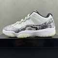 Low-top sneaker with white leather panels and snakeskin-textured side panel in gray and black