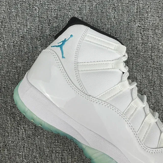 White Air Jordan 11 high-top sneakers with teal Jumpman logo and mint-green sole