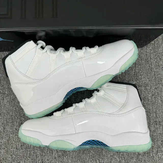 Side-by-side white Air Jordan 11 high-top sneakers with teal accents and mint-green soles