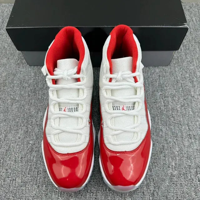 Front view of red patent and white mesh high-top sneakers with white laces