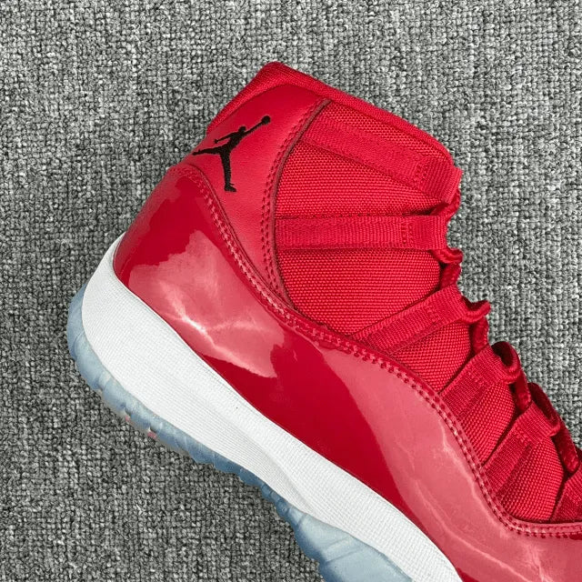 Red high-top sneaker side view with patent finish and white midsole