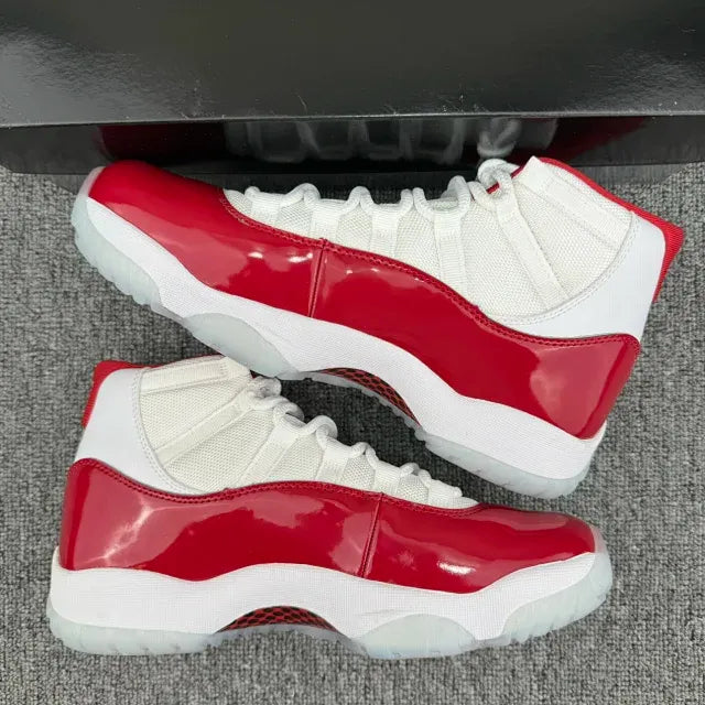 Red and white high-top sneakers, side view with glossy red stripe and white sole