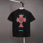 Black graphic T-shirt with large pink and blue cross emblem on back