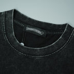 Black crewneck T-shirt neckline with interior brand tag detail