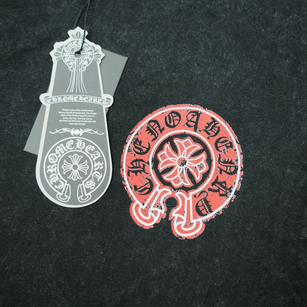 Black T-shirt fabric with large red circular graphic and white hang tag