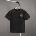 Black graphic T-shirt with red emblem on the chest