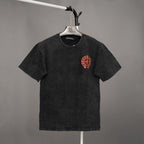 Black graphic T-shirt with red emblem on the chest