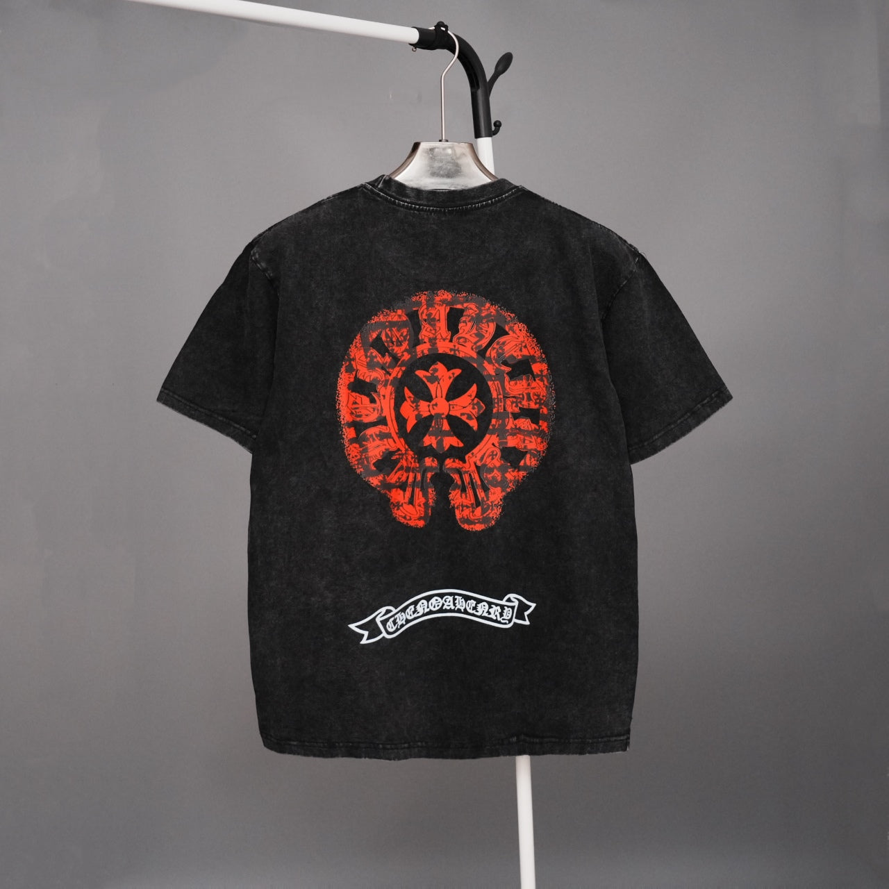Black graphic T-shirt with large red skull emblem on the back and small logo