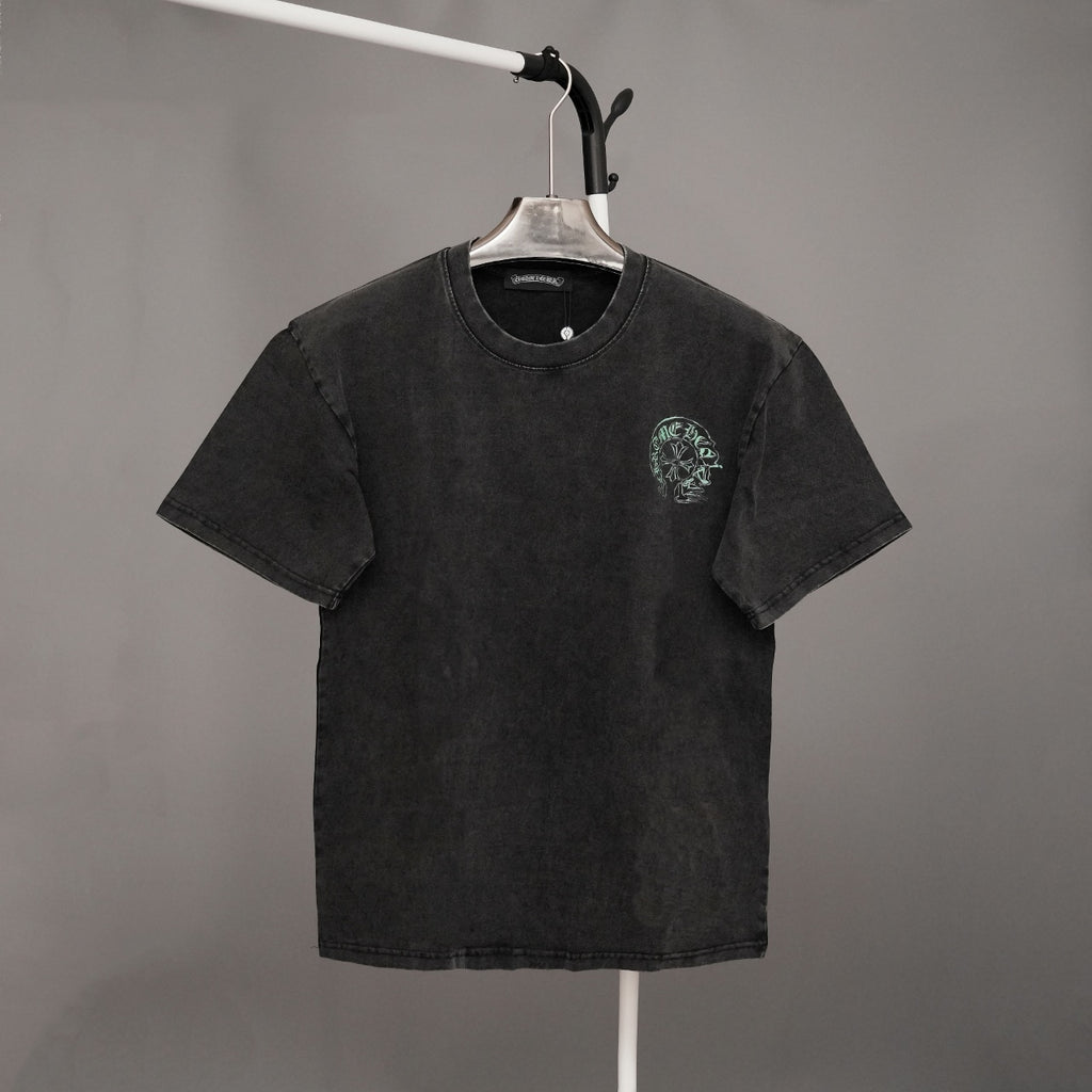 Black graphic T-shirt with small green emblem on left chest and crew neck