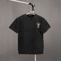 Black crewneck T-shirt with small chest graphic