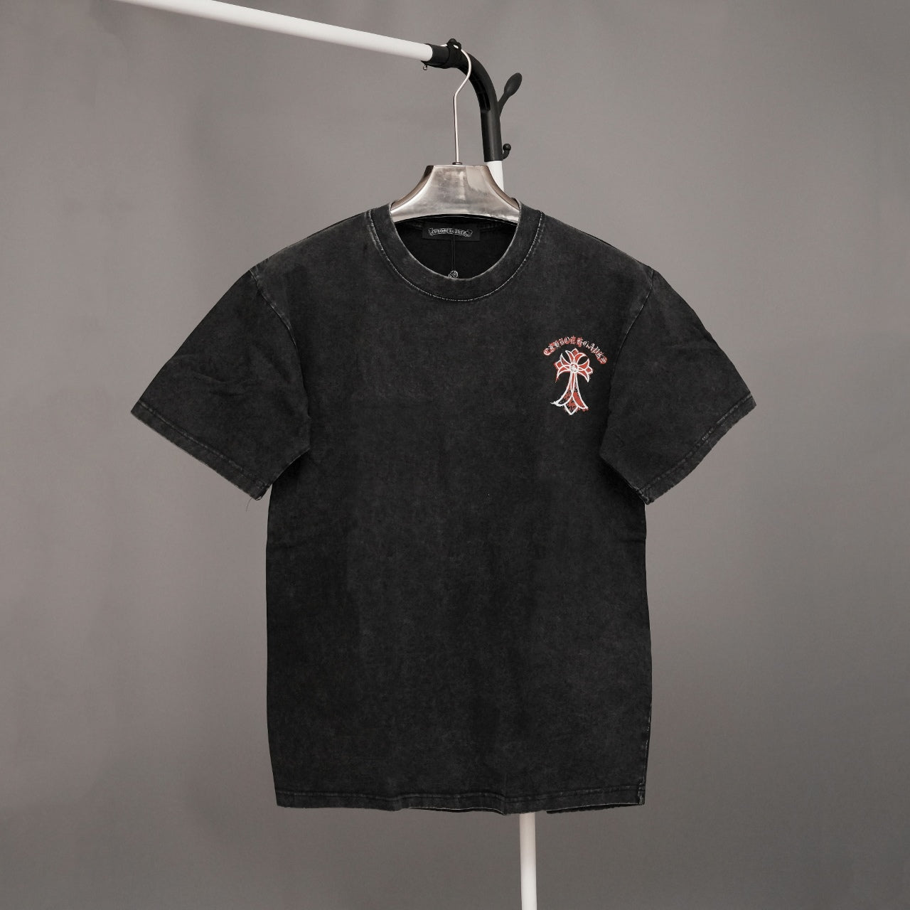 Black crewneck T-shirt with small chest graphic