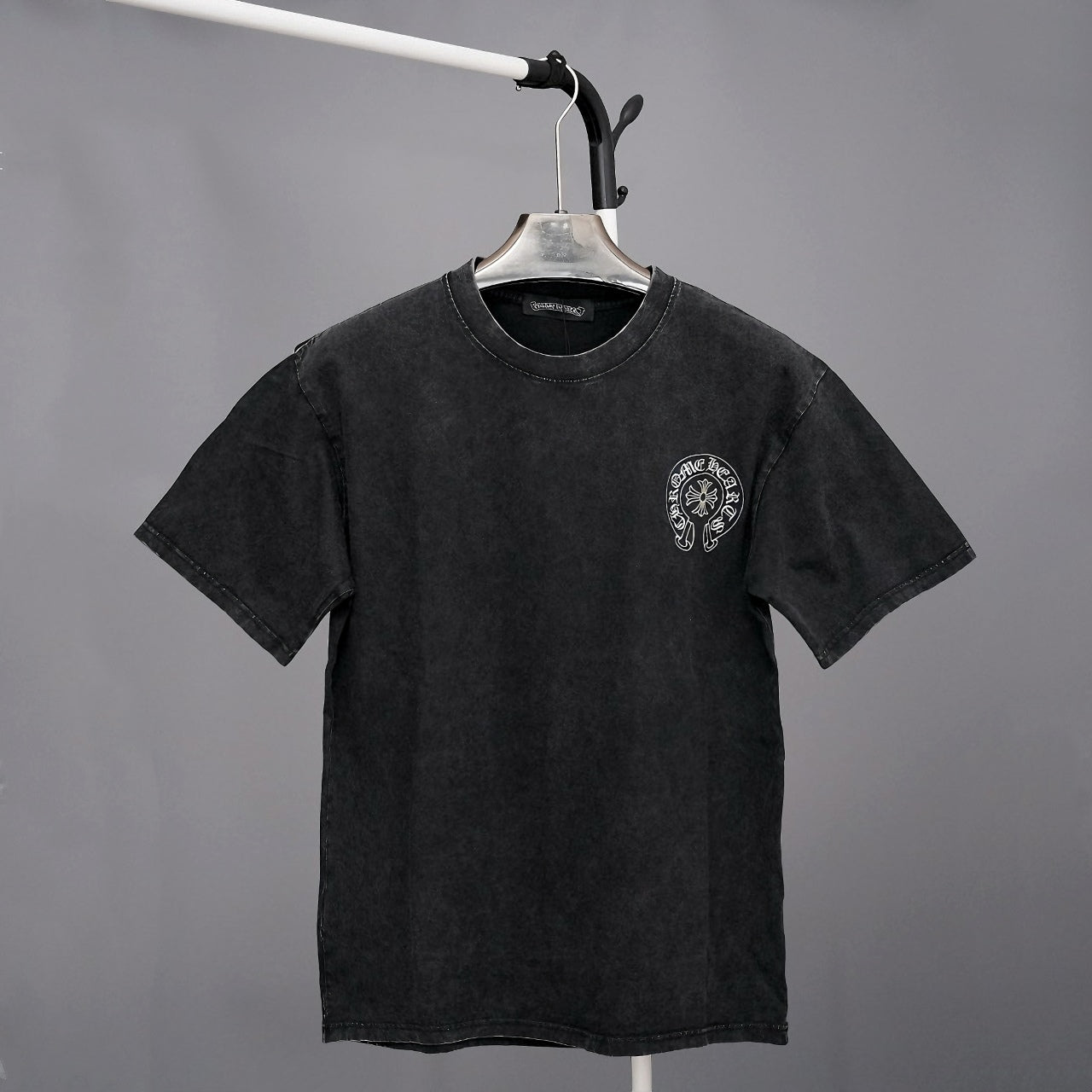 Black short-sleeve T-shirt with small chest emblem logo