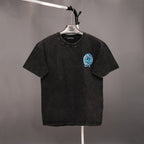 Black short-sleeve T-shirt on a hanger with small blue graphic on the chest