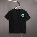 Black short-sleeve T-shirt with small blue graphic on left chest
