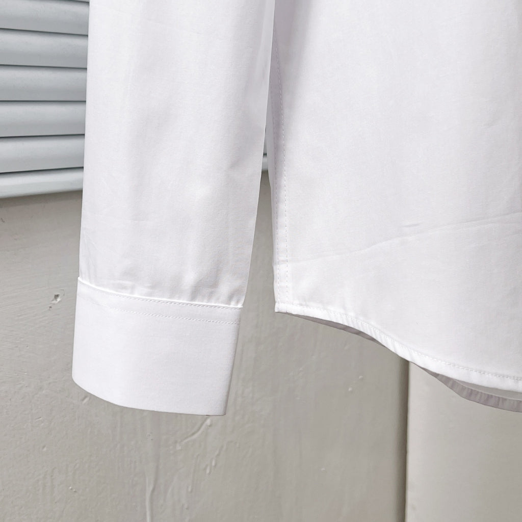 Dior long-sleeve shirt hem and sleeve cuff, white, side close-up