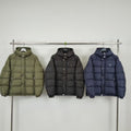 Olive puffer jacket with hood, button front, and front pockets
