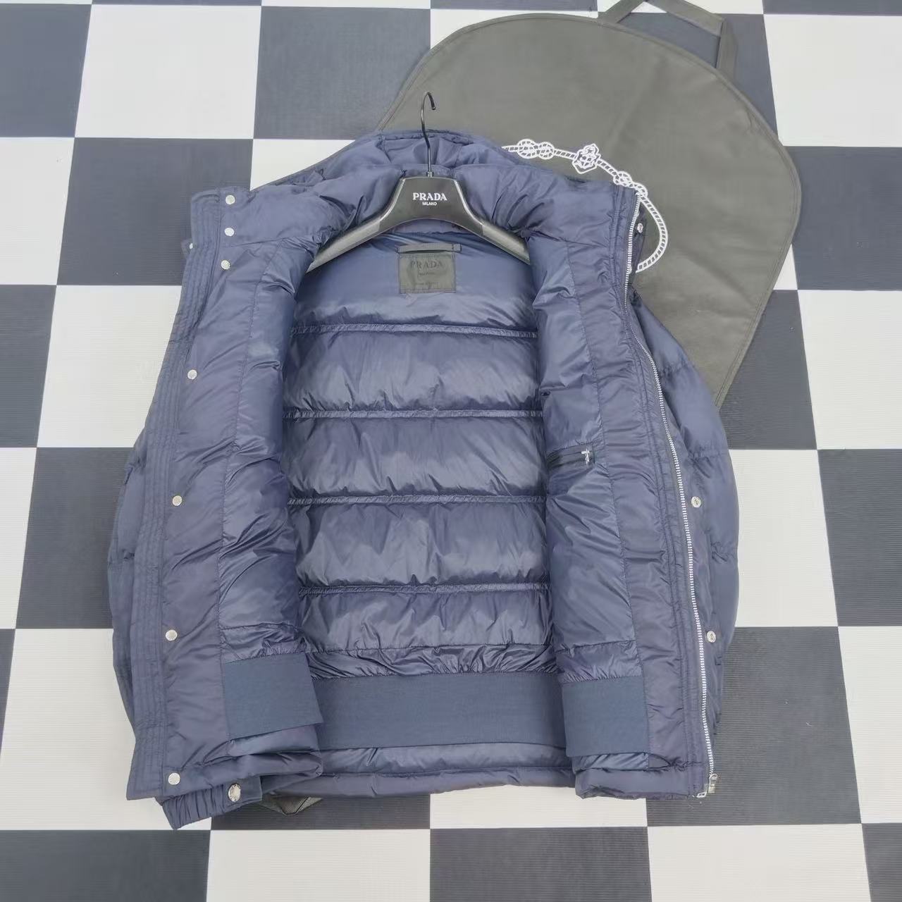 Navy puffer jacket interior with quilted lining and hood