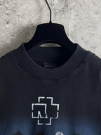 Black crewneck T-shirt neckline with white graphic cross and small text print