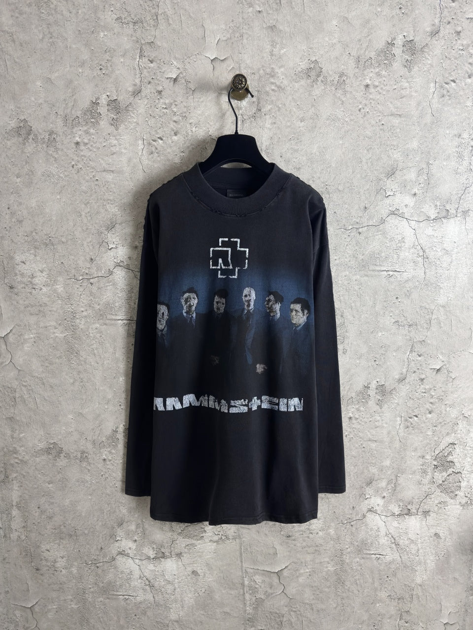 Black long-sleeve crewneck T-shirt with front graphic print and crew neckline