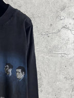 Black long-sleeve T-shirt sleeve area with faded figure print in gray