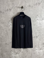 Black long-sleeve T-shirt on hanger, rhinestone BALENCIAGA logo on chest