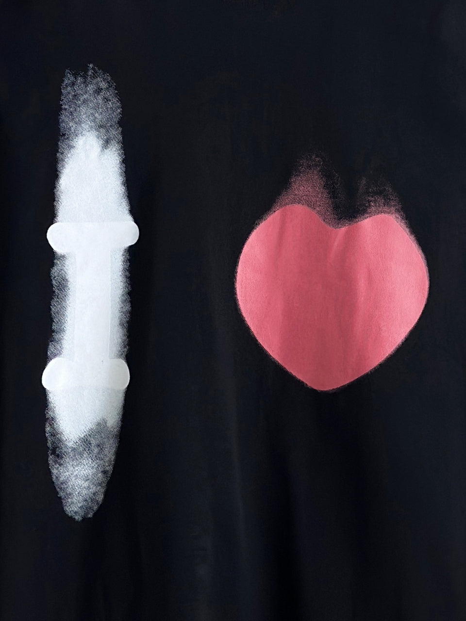 Balenciaga long-sleeve top front close-up: white candle and pink heart graphic