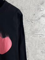Balenciaga long-sleeve top sleeve view with pink heart graphic detail