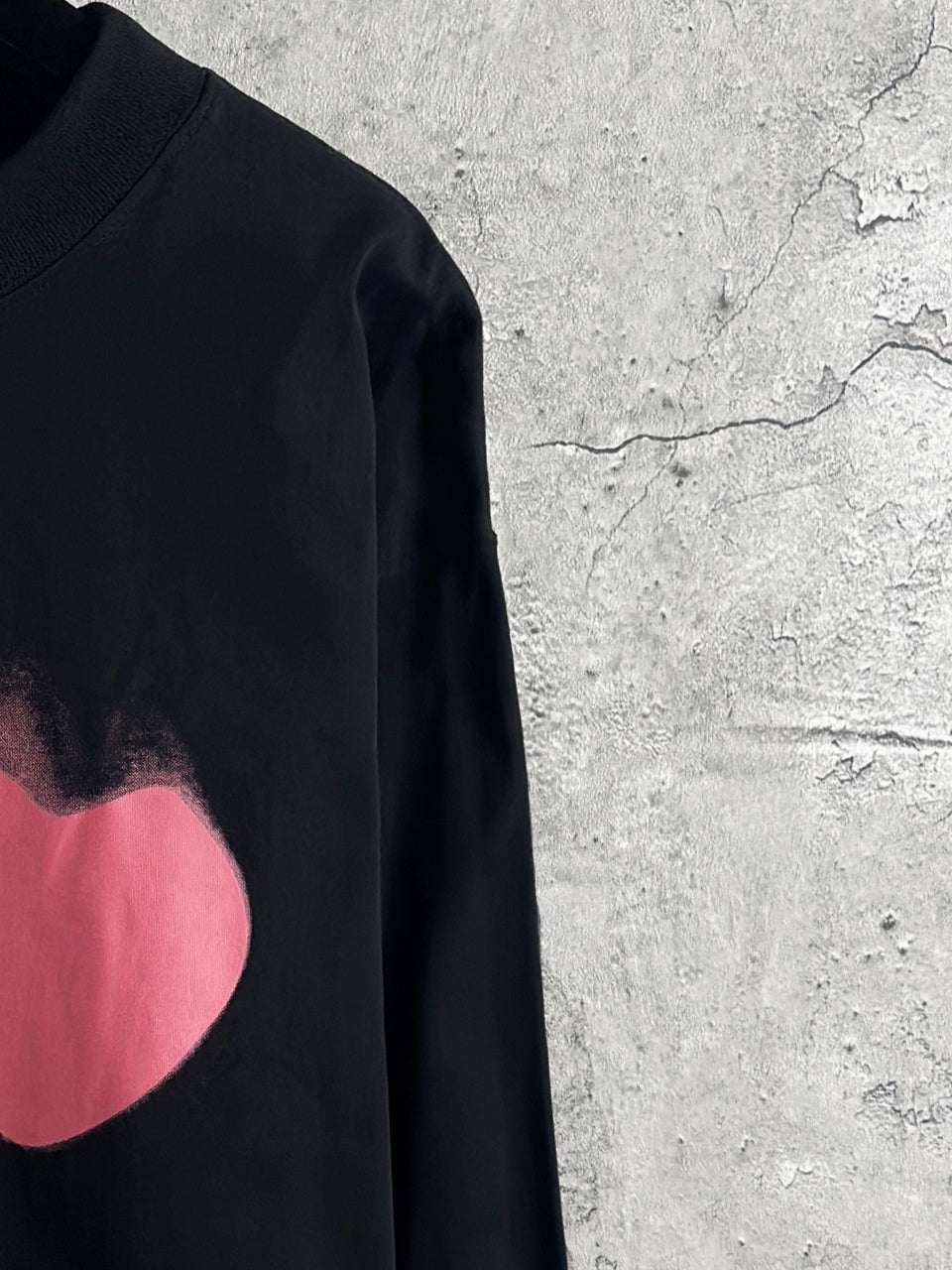 Balenciaga long-sleeve top sleeve view with pink heart graphic detail