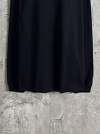 Balenciaga long-sleeve top full back view, dark fabric with straight hem