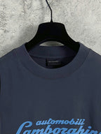 Dark blue crewneck long-sleeve T-shirt neckline with small Balenciaga logo tag.