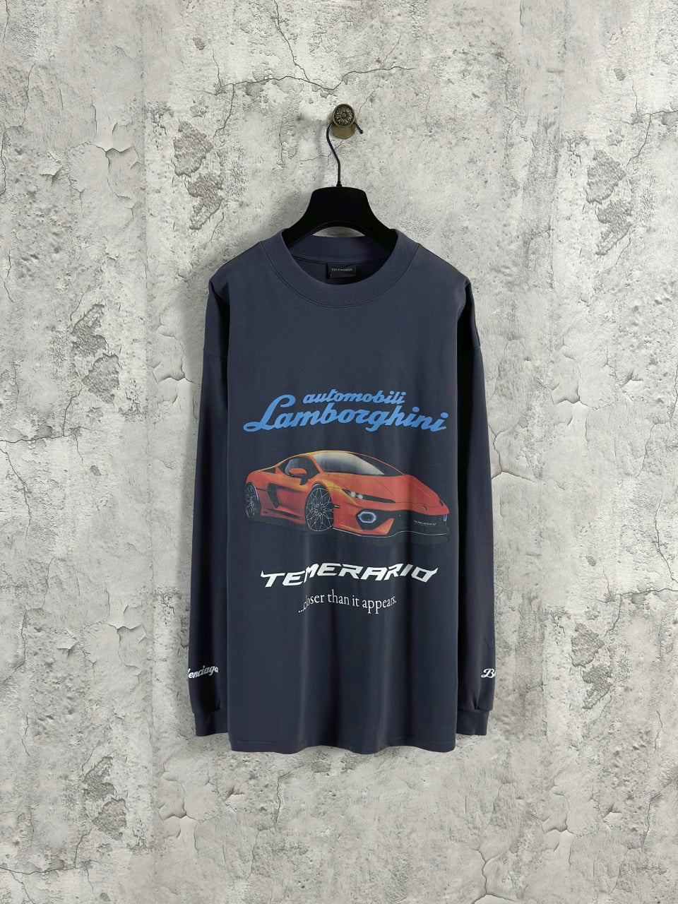 Dark blue long-sleeve crewneck T-shirt with Lamborghini and car graphic on front.