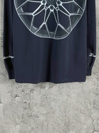 Dark blue long-sleeve T-shirt back view with large white wheel graphic near top.
