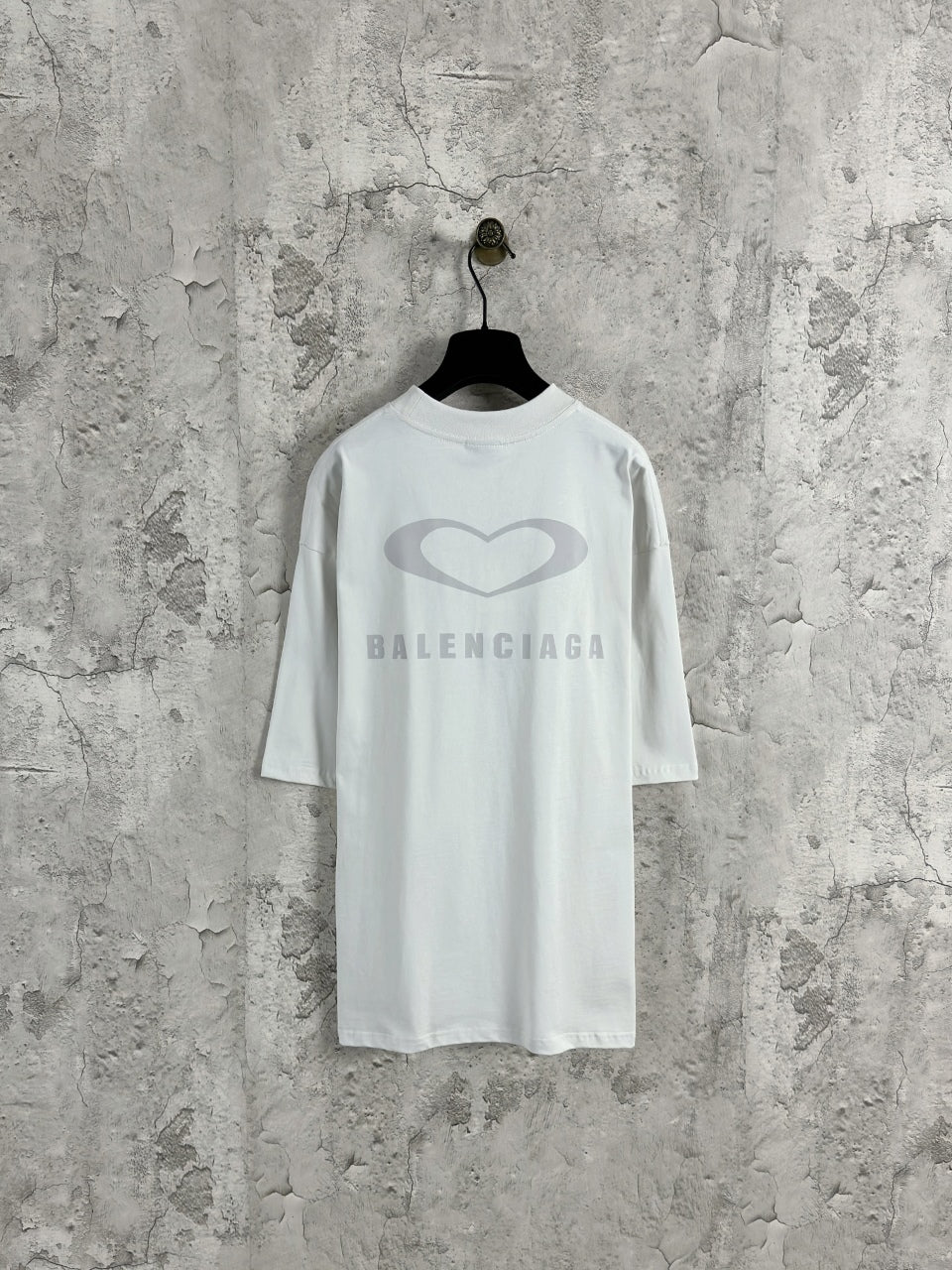 White Balenciaga crewneck T-shirt on hanger, back heart and BALENCIAGA logo