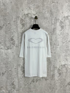 White Balenciaga crewneck T-shirt on hanger, back heart and BALENCIAGA logo