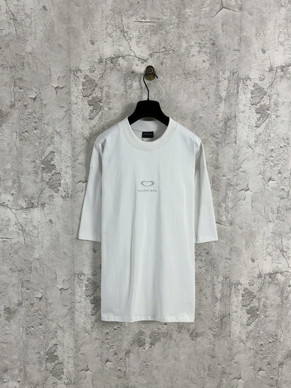 White Balenciaga crewneck T-shirt on hanger, short sleeves, front heart logo