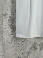White Balenciaga T-shirt hem view, clean finish on short sleeves