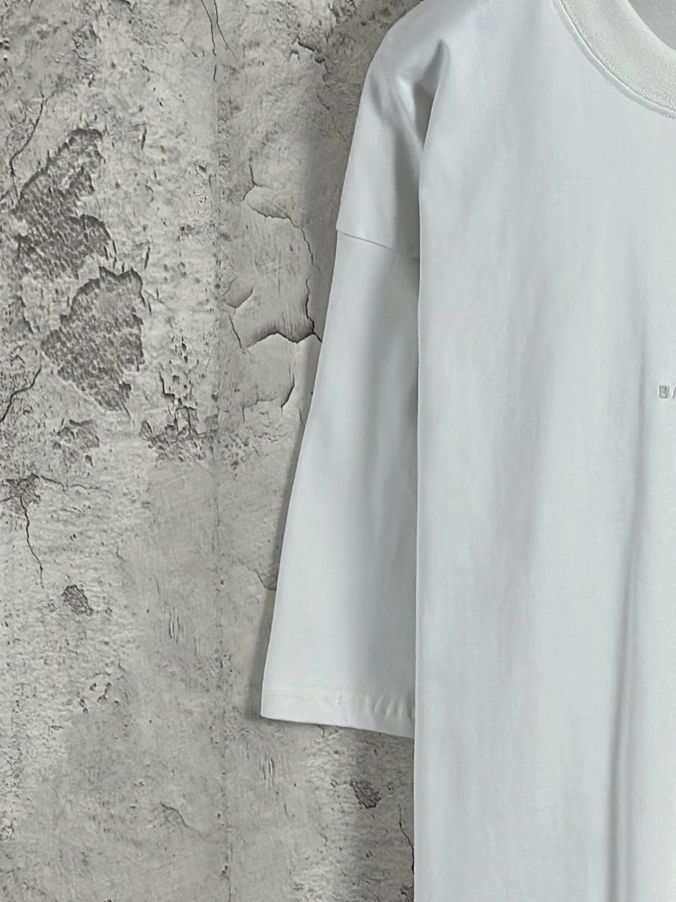 White Balenciaga short-sleeve T-shirt side view, smooth fabric with logo mark