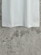White Balenciaga short-sleeve T-shirt bottom hem view with straight hemline