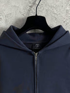 Balenciaga navy hoodie front with zipper, hood, and small chest logo