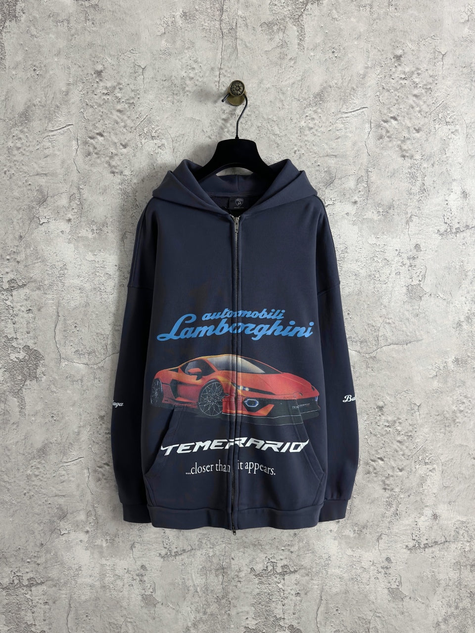 Balenciaga navy zip-up hoodie with car and text graphic on front