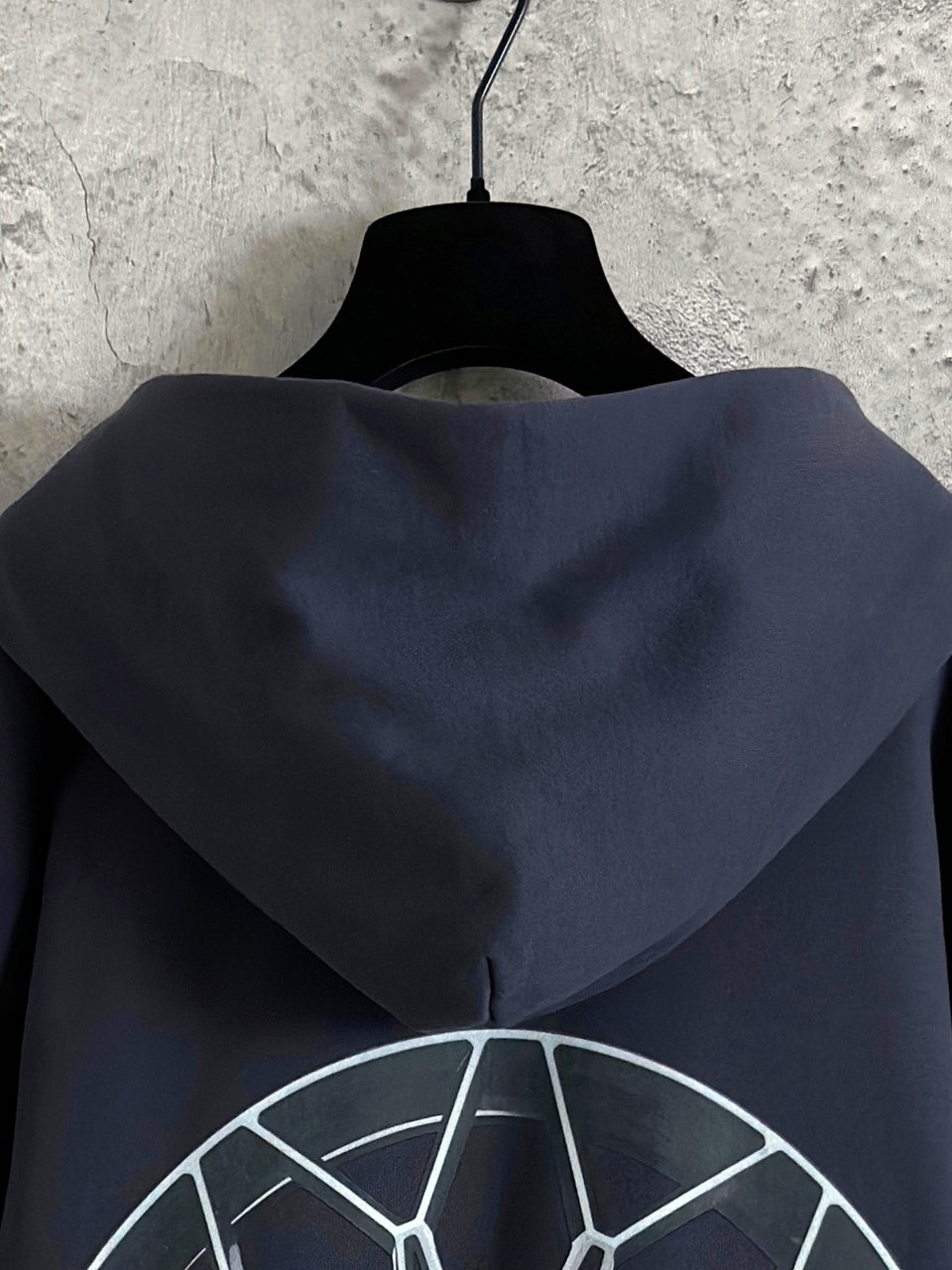 Balenciaga navy zip-up hoodie back with large hood and wheel graphic