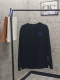 Navy long-sleeve crewneck sweatshirt with small blue chest logo