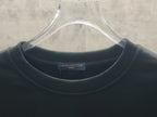 Dark crewneck sweatshirt neckline with Louis Vuitton inner label
